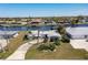 Aerial view of canal front home with large lot and neighborhood at 217 W Tarpon Nw Blvd, Port Charlotte, FL 33952