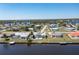 Aerial view of waterfront home with pool and private dock at 217 W Tarpon Nw Blvd, Port Charlotte, FL 33952