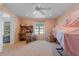 Cozy bedroom with a desk, window, and ceiling fan at 217 W Tarpon Nw Blvd, Port Charlotte, FL 33952