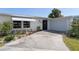 House exterior featuring a carport and well-maintained yard at 217 W Tarpon Nw Blvd, Port Charlotte, FL 33952