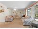 Bright living room with floral sofas and large windows at 217 W Tarpon Nw Blvd, Port Charlotte, FL 33952