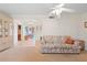 Living room featuring floral sofa and view to another room at 217 W Tarpon Nw Blvd, Port Charlotte, FL 33952