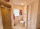 Simple bathroom with shower, toilet and linen closet at 2219 Bengal Ct, Punta Gorda, FL 33983