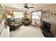 Relaxing guest room featuring two comfy armchairs, a TV, and ample natural light at 2219 Bengal Ct, Punta Gorda, FL 33983