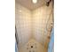 Clean shower stall with tiled walls and a seashell-designed floor at 2219 Bengal Ct, Punta Gorda, FL 33983