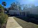 Building exterior showcasing landscaping and walkway at 2290 Aaron St # 302, Port Charlotte, FL 33952