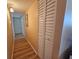 Hallway with light wood flooring at 2290 Aaron St # 302, Port Charlotte, FL 33952