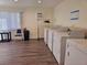 Well-lit laundry room with several washers and dryers at 2290 Aaron St # 302, Port Charlotte, FL 33952