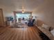 Living room with wood floors, open layout, and view to the dining area at 2290 Aaron St # 302, Port Charlotte, FL 33952