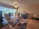 Living room with wood floors, open layout, and view to the dining area at 2290 Aaron St # 302, Port Charlotte, FL 33952