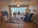 Living room with wood floors, open layout, and view to the dining area at 2290 Aaron St # 302, Port Charlotte, FL 33952