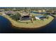 Aerial view of waterfront homes with solar panels and private pools at 24337 Contra Costa Ln, Punta Gorda, FL 33955