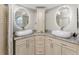 Double vanity bathroom with granite countertops and oval sinks at 24337 Contra Costa Ln, Punta Gorda, FL 33955