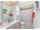 Bathroom with flamingo shower curtain and single vanity at 24337 Contra Costa Ln, Punta Gorda, FL 33955