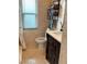 Bathroom with toilet, sink, and a towel rack at 310 Belvedere Ct, Punta Gorda, FL 33950