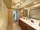 Double vanity bathroom with hardwood floors at 310 Belvedere Ct, Punta Gorda, FL 33950