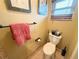 Small bathroom with toilet, sink and shower at 310 Belvedere Ct, Punta Gorda, FL 33950