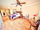 Main bedroom with hardwood floors and ceiling fan at 310 Belvedere Ct, Punta Gorda, FL 33950