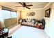 Relaxing bedroom with a sofa and ceiling fan at 310 Belvedere Ct, Punta Gorda, FL 33950