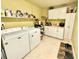 Bright laundry room with washer, dryer, and cabinets at 310 Belvedere Ct, Punta Gorda, FL 33950