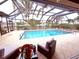 Inviting screened-in pool and patio with lounge chairs at 310 Belvedere Ct, Punta Gorda, FL 33950