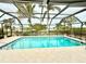 Inviting screened pool with clear water and tile deck at 310 Belvedere Ct, Punta Gorda, FL 33950