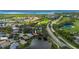 Property is shown in an aerial view near water and golf course at 3191 Village Ln, Port Charlotte, FL 33953