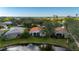 Aerial view of houses and a pond at 3191 Village Ln, Port Charlotte, FL 33953