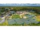 Aerial view of community amenities including tennis courts and clubhouse at 3191 Village Ln, Port Charlotte, FL 33953