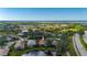 Aerial view showing home's location near water and golf course at 3191 Village Ln, Port Charlotte, FL 33953