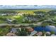 Bird's eye view of home, near golf course and body of water at 3191 Village Ln, Port Charlotte, FL 33953