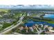 Home's location is highlighted in an aerial view of the community at 3191 Village Ln, Port Charlotte, FL 33953