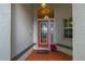 Front entry with red door and decorative glass at 3191 Village Ln, Port Charlotte, FL 33953