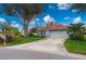 Single-story home with red tile roof, attached garage, and landscaped yard at 3191 Village Ln, Port Charlotte, FL 33953