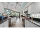 Bright kitchen featuring granite countertops and white cabinetry at 3191 Village Ln, Port Charlotte, FL 33953