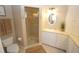 Bathroom with a walk-in shower, single vanity, and neutral tile at 3216 Purple Martin Dr # 123, Punta Gorda, FL 33950