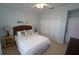 Guest bedroom with a queen bed, built-in closet, and neutral decor at 3216 Purple Martin Dr # 123, Punta Gorda, FL 33950