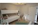 Well-lit bedroom featuring a bunk bed, carpet, and ample floor space at 3216 Purple Martin Dr # 123, Punta Gorda, FL 33950