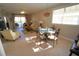 Sunlit dining area with glass top table and four ornate chairs at 3216 Purple Martin Dr # 123, Punta Gorda, FL 33950