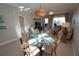 Charming dining area with a glass-top table and four ornate chairs at 3216 Purple Martin Dr # 123, Punta Gorda, FL 33950