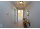 Bright hallway with tiled floors and a console table at 3216 Purple Martin Dr # 123, Punta Gorda, FL 33950