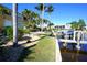 Landscaped grounds with lush tropical plants and a waterfront view at 3216 Purple Martin Dr # 123, Punta Gorda, FL 33950