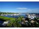 View of a marina with many boats and palm trees at 3216 Purple Martin Dr # 123, Punta Gorda, FL 33950