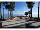 Scenic waterfront view with palm trees and benches at 3216 Purple Martin Dr # 123, Punta Gorda, FL 33950