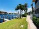 Peaceful waterfront walkway with lush landscaping at 3311 Wood Thrush Dr # 111, Punta Gorda, FL 33950