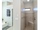 Walk-in shower with tile surround and built-in seat at 4037 Bal Harbor Blvd, Punta Gorda, FL 33950