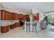 Kitchen boasts wood cabinets, granite counters, and breakfast bar at 4037 Bal Harbor Blvd, Punta Gorda, FL 33950