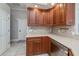 Kitchen with wood cabinets, granite countertops, and a dishwasher at 4037 Bal Harbor Blvd, Punta Gorda, FL 33950