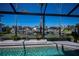 Stunning view of the pool and canal from the screened enclosure at 4037 Bal Harbor Blvd, Punta Gorda, FL 33950