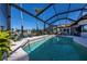 Relaxing screened pool with ample space for lounging and entertaining at 4037 Bal Harbor Blvd, Punta Gorda, FL 33950